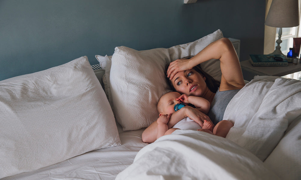 baby and mother trying to sleep