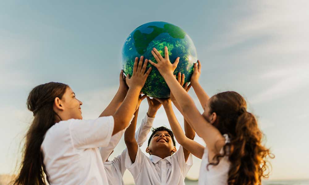 children holding planet earth