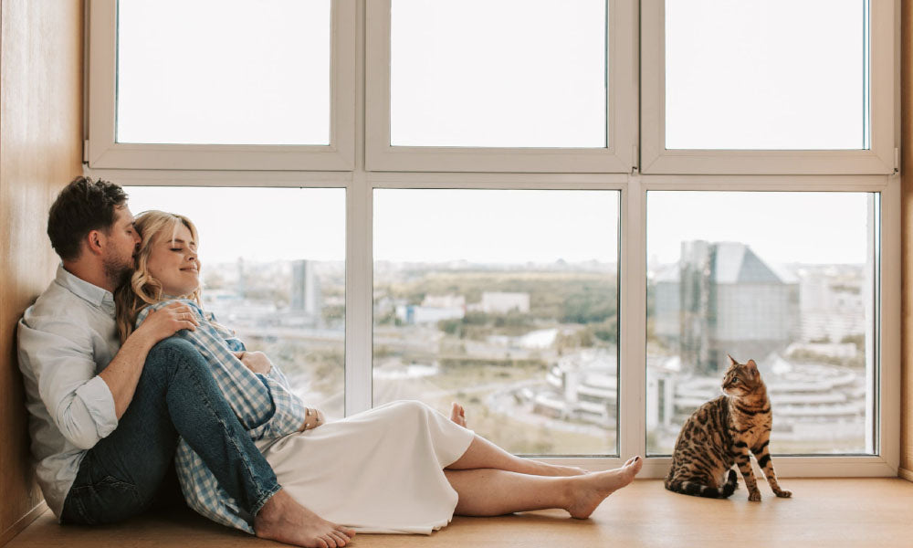couple relaxing with cat