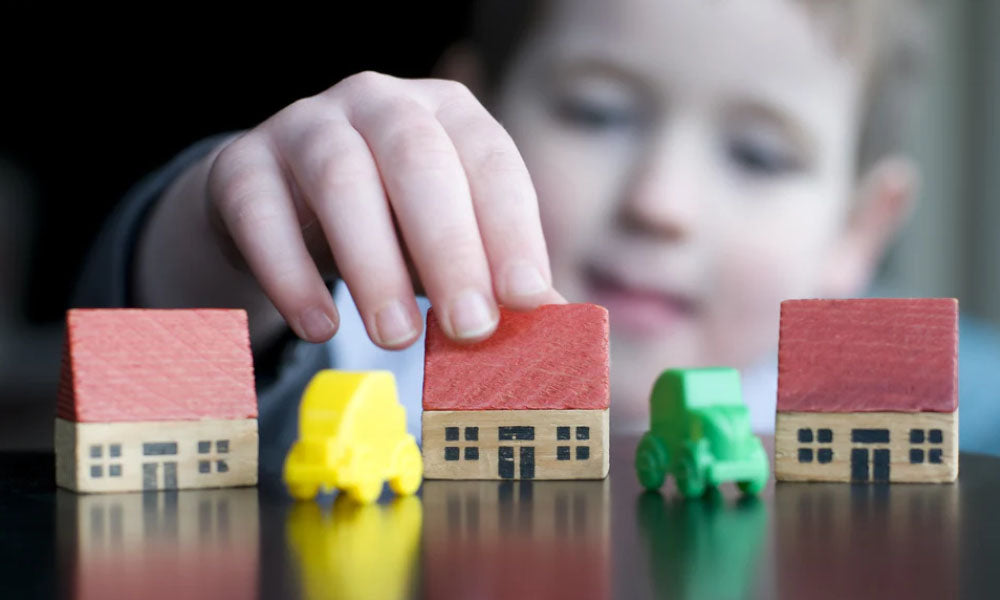 little boy playing with colorful modeling clay