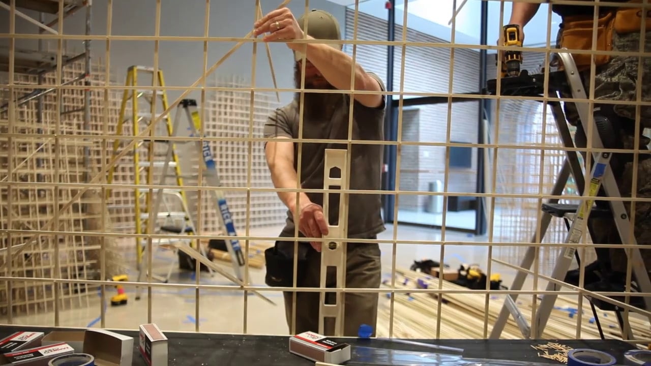 carpenter working with wood building large item