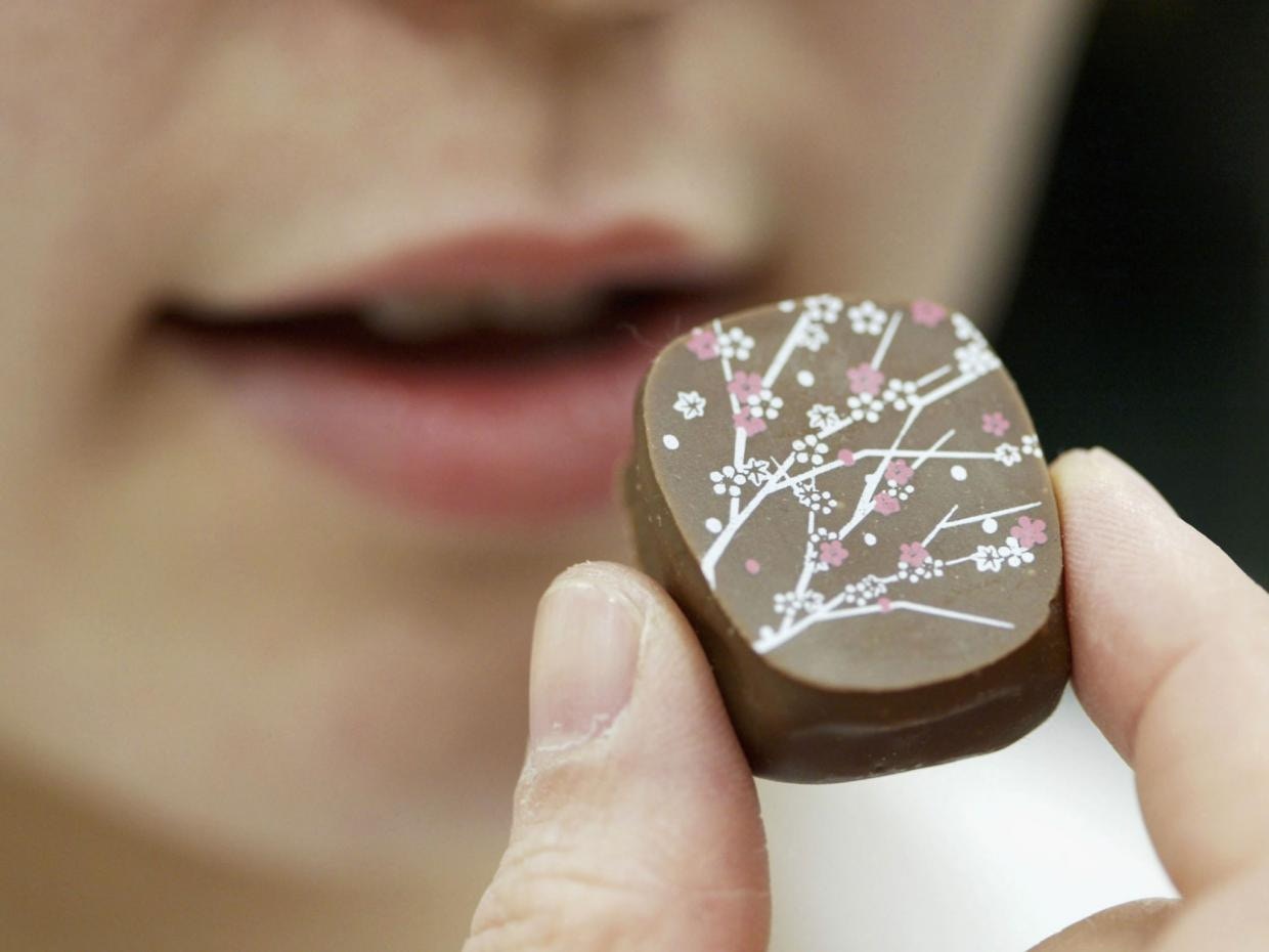 young lady eating chocolate