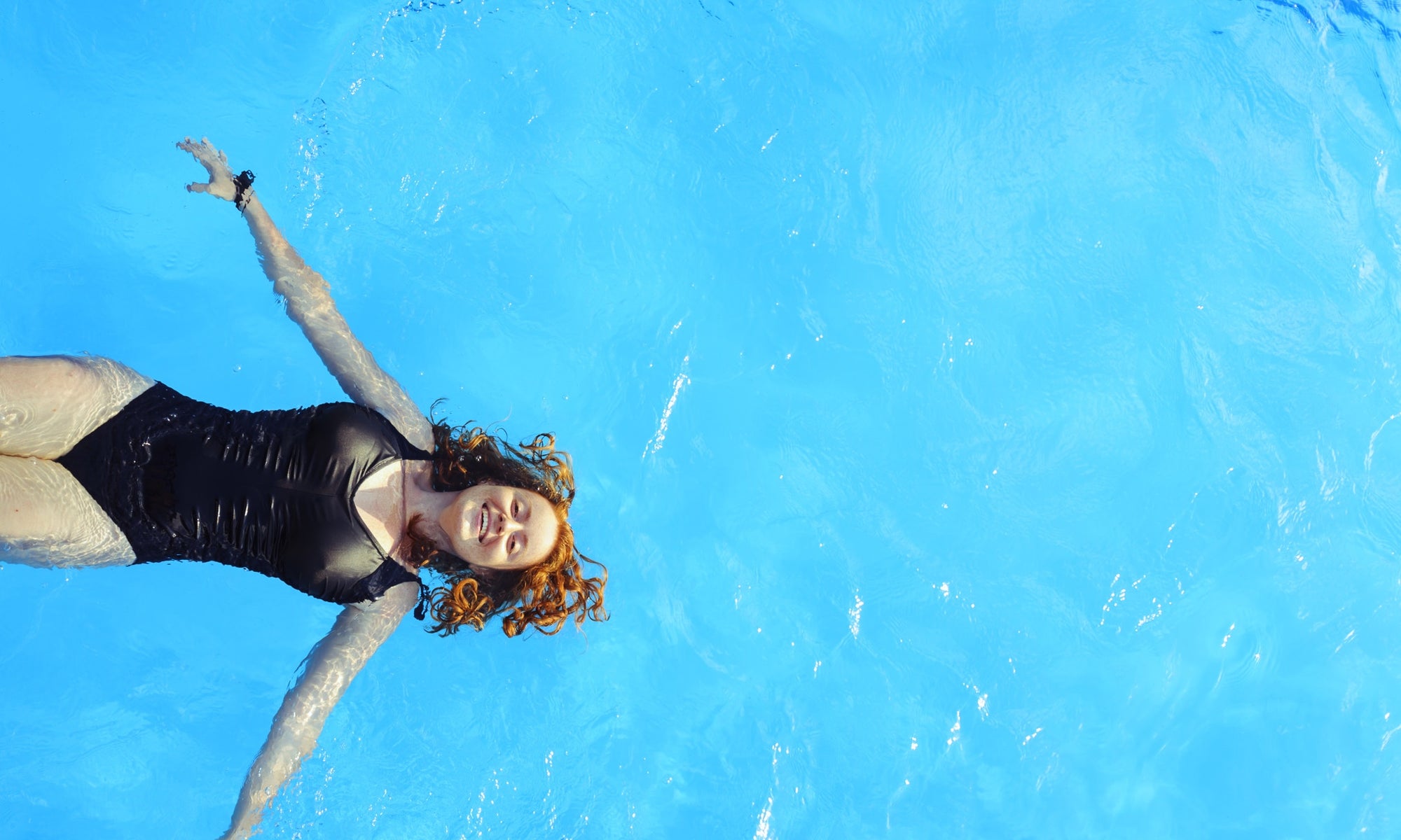 A woman swimming in a pool