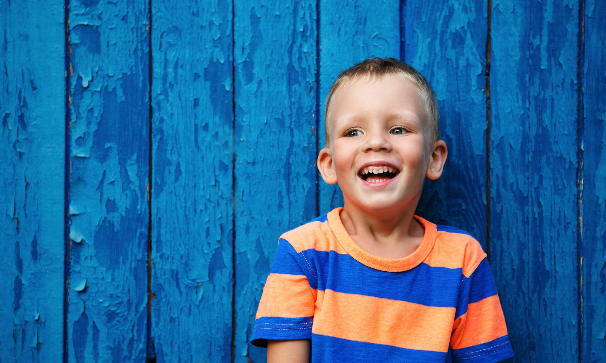 Smiling child picture with blue background