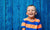 Smiling child picture with blue background