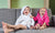 Two children sitting on a couch