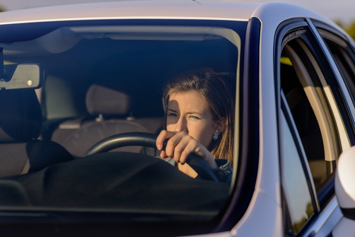 Sunlight in lady's eyes while driving