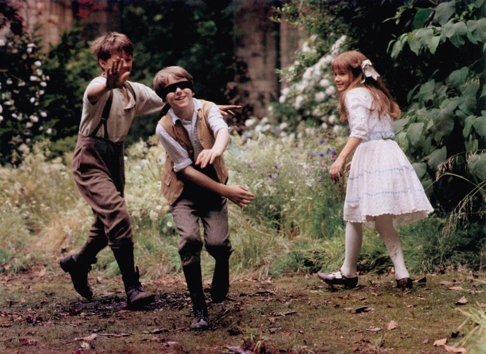 Three children playing blind fold