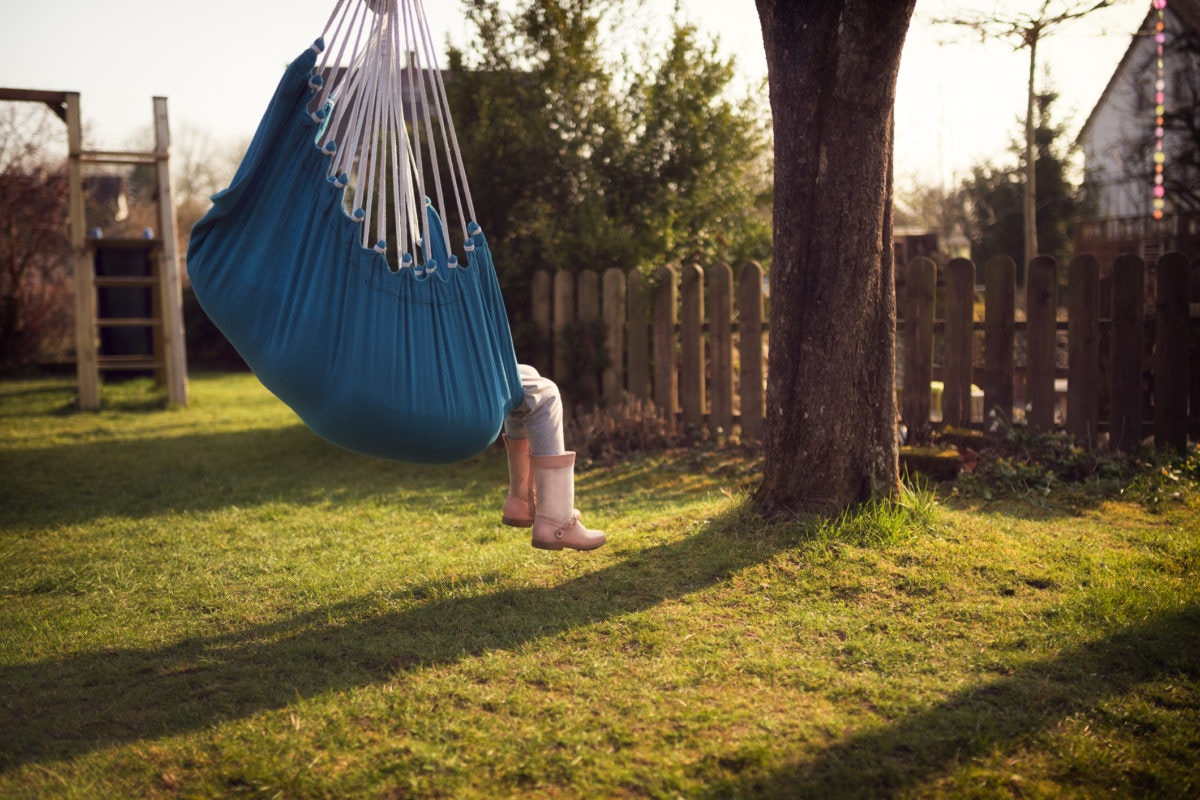 A child swinging in tree