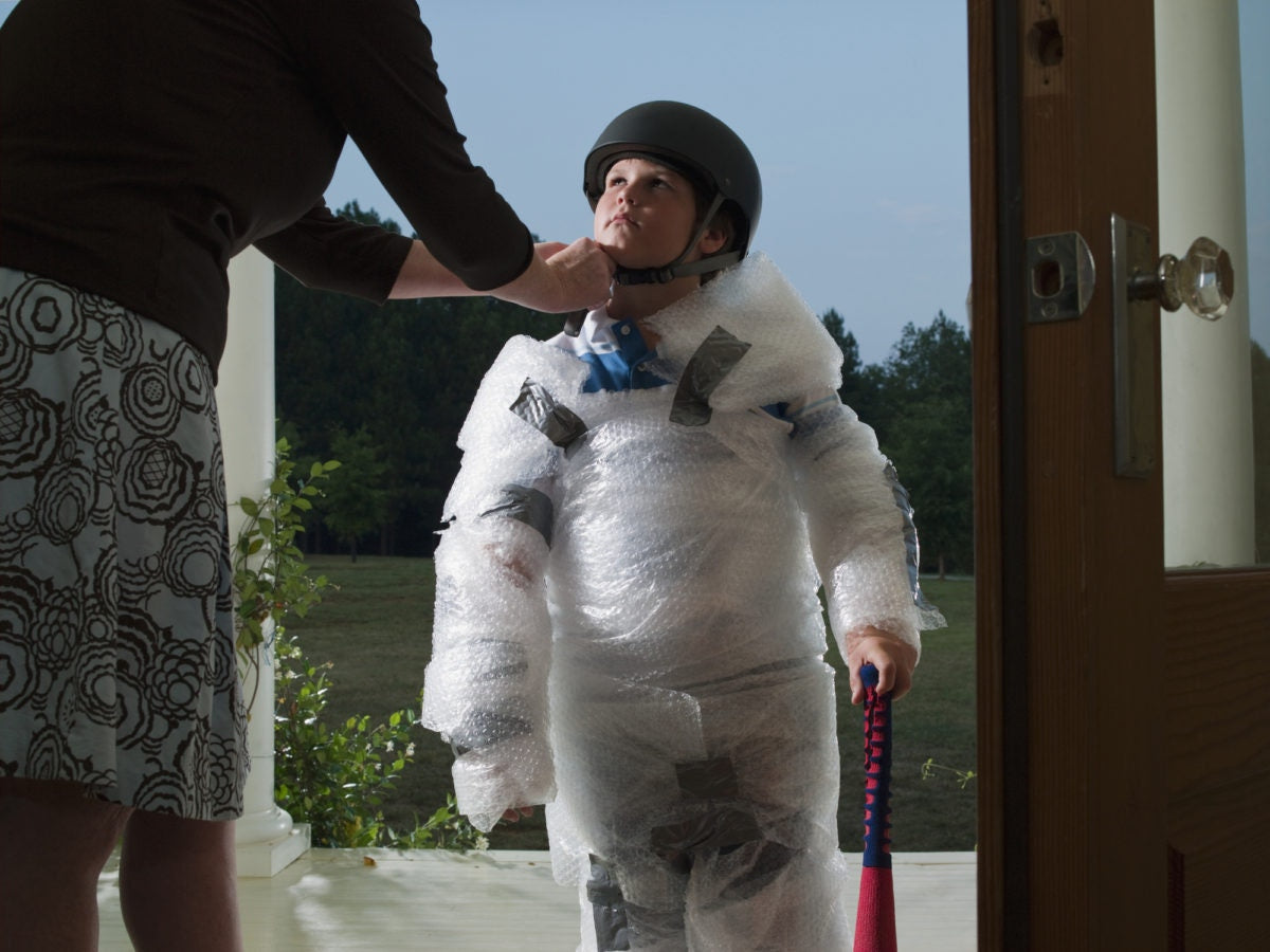 mother wraps young boy in wrap bubbles