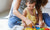 Mother and daughter playing with toy on floor