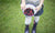 kid showing a bowl full of blueberries and raspberries