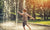 boy playing with water from a fountain 