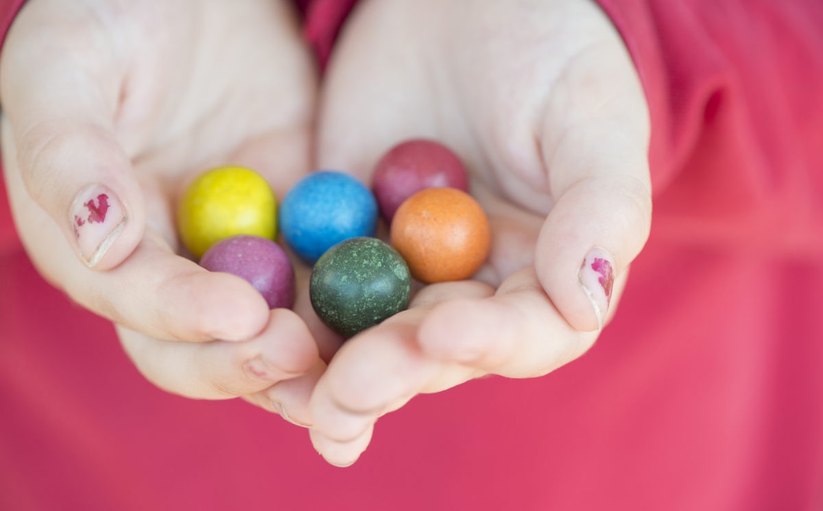 Holding marbles in a hand