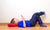 boy lying on floor of bedroom using mobile phone