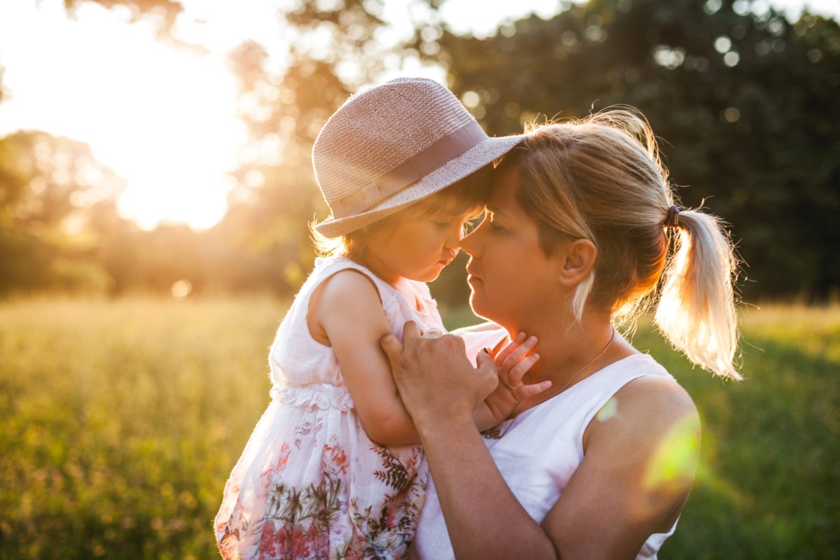 mother with her baby on sunny day