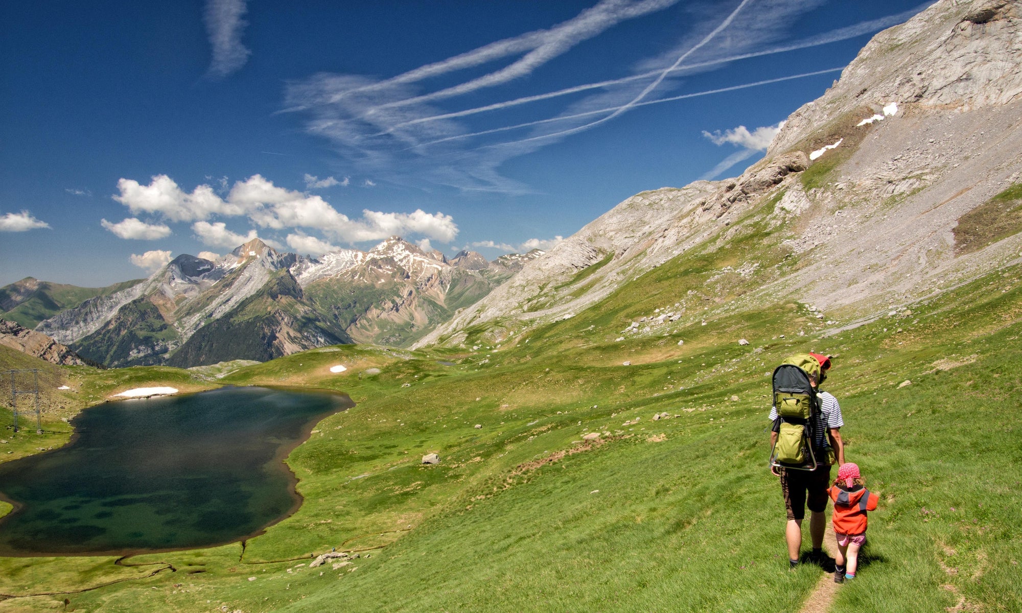 Mother and her kid going for a mountain hiking