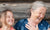 Cheerful young grand daughter and grand mother talking ,laughing at home