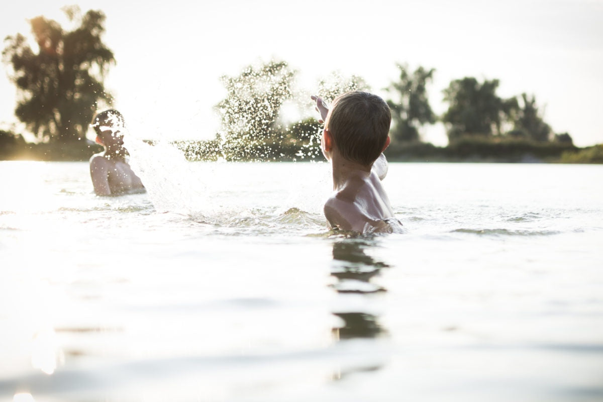 Two person swimming on a pool