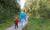 Back view of Grandmother and granddaughter are walking outdoors