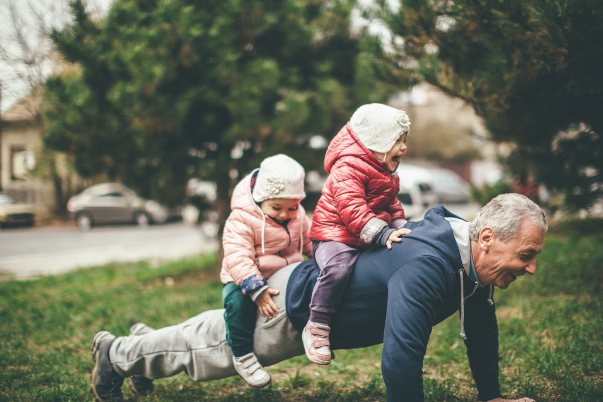 grandfather with grandchild on back