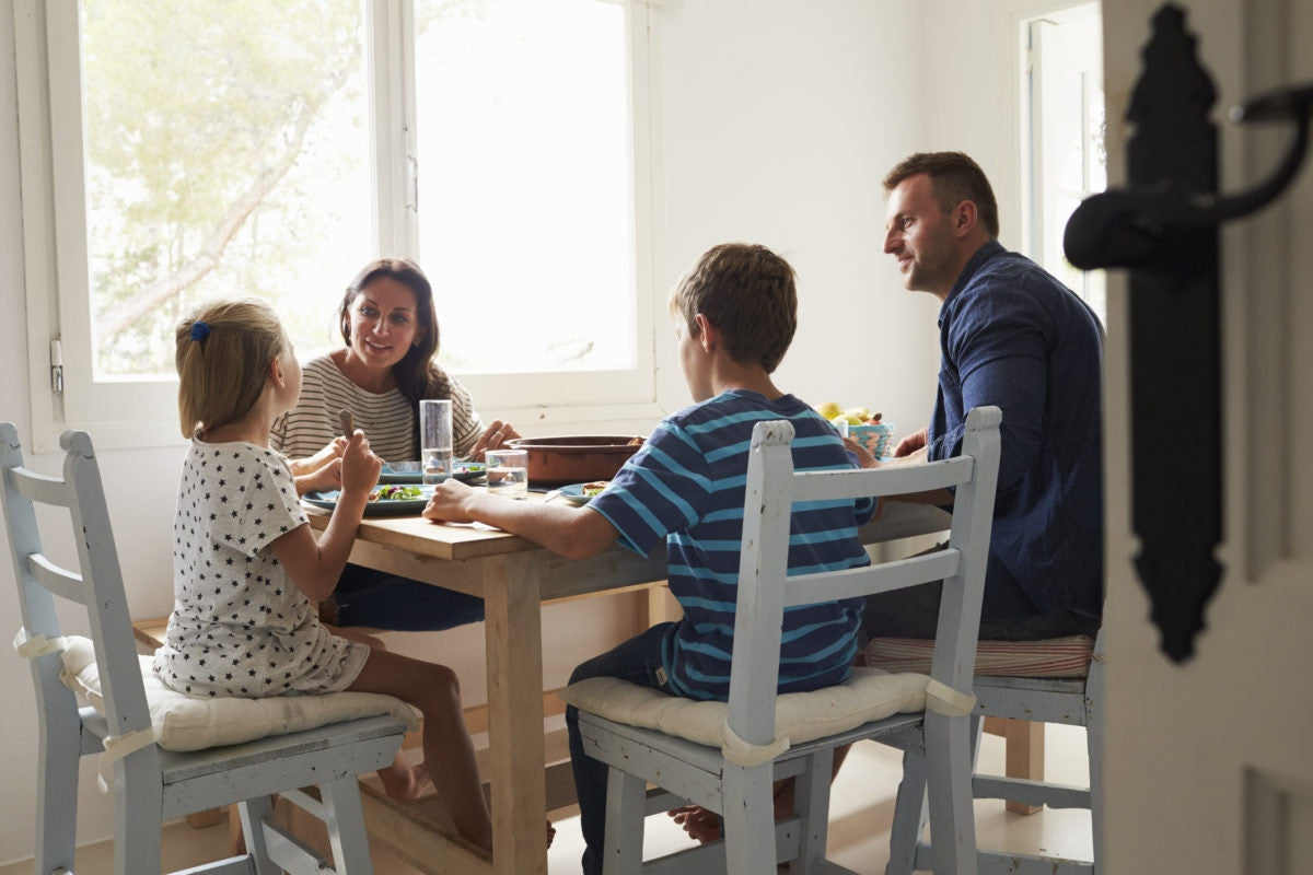 Family discussion in dining hall while having lunch