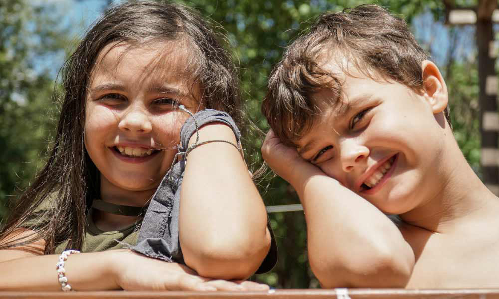 girl and boy smiling