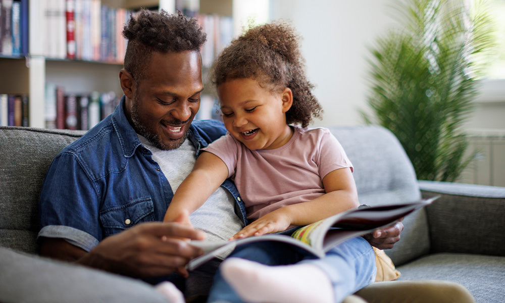 father and daughter on couch