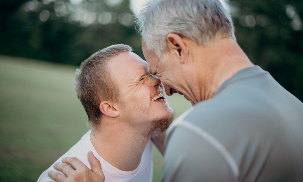 father and son laughing