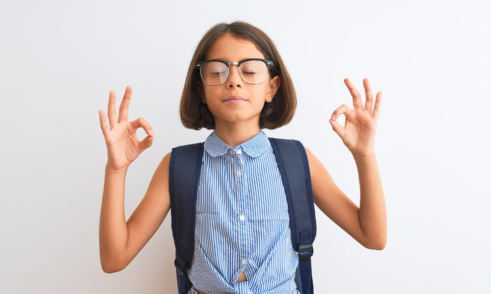 girl wearing backpack and glasses