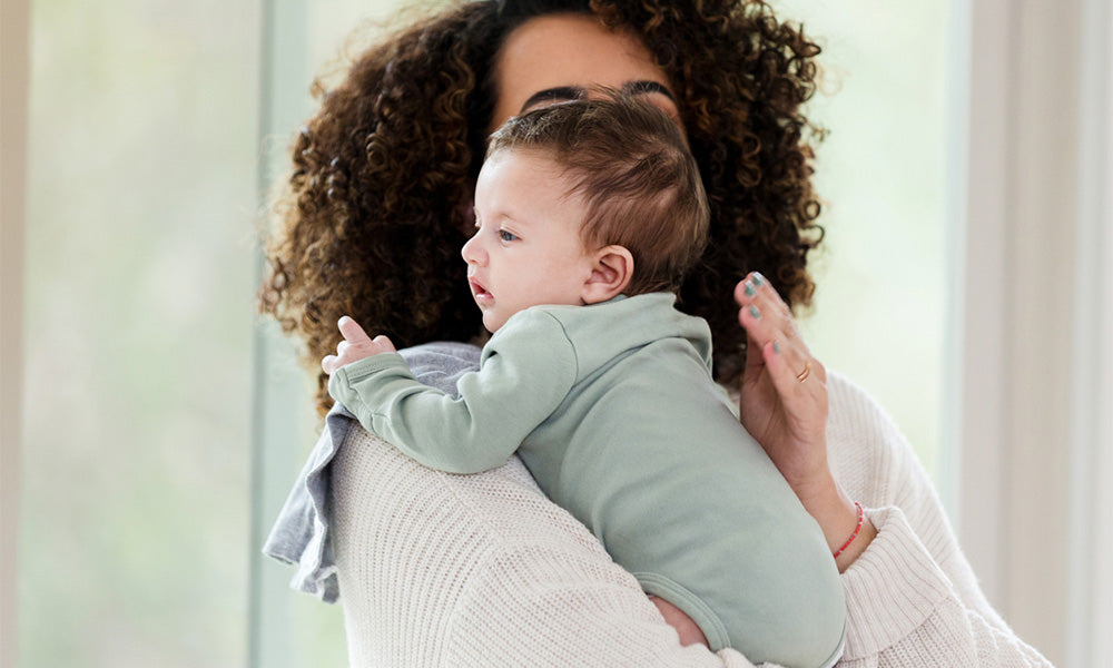 mom holding baby