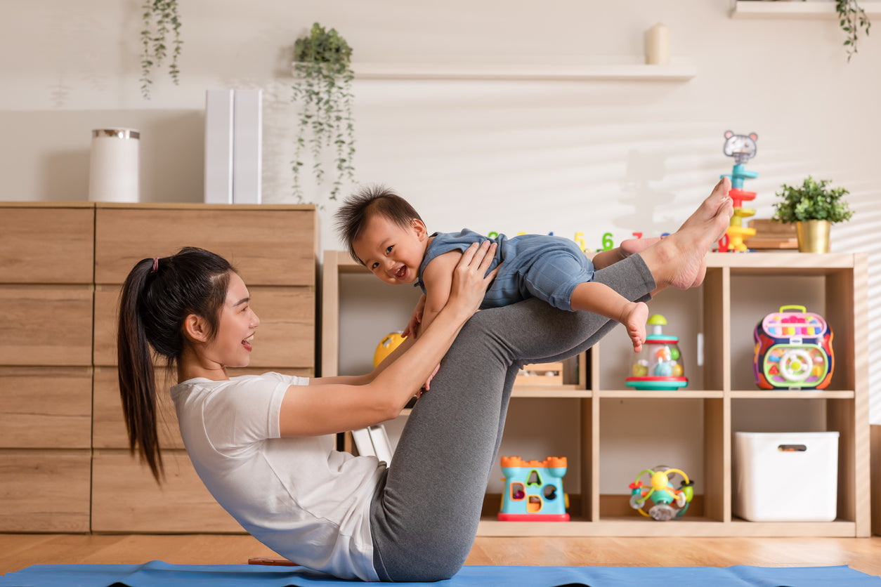 mother playing with baby