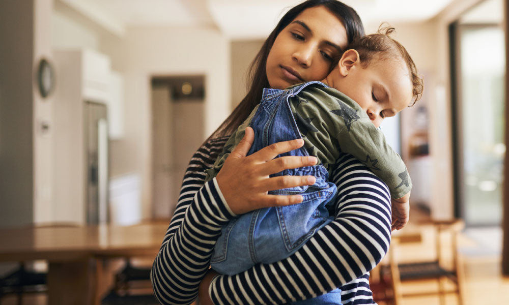 mother holding her son